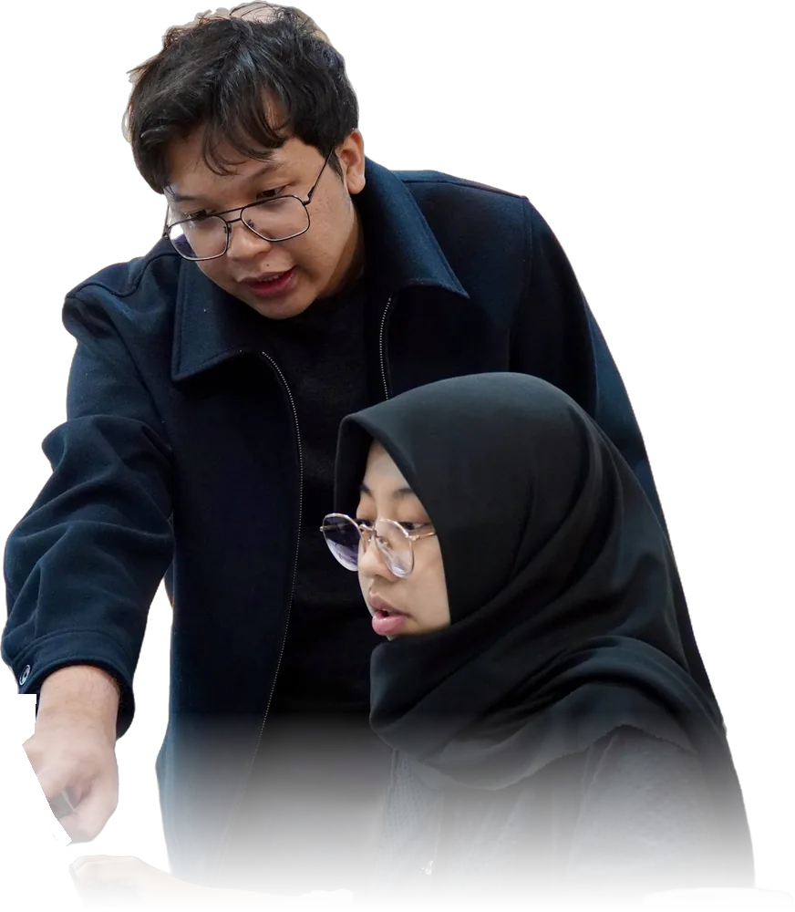 Adam guiding a student one-on-one on her laptop